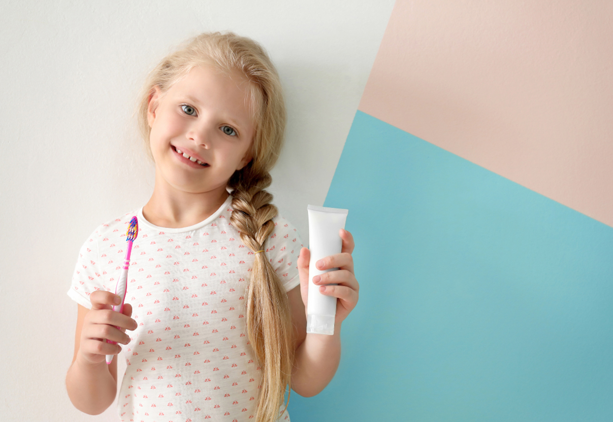 kids dentist at Smile Town Dental Group demonstrating cavity prevention strategies