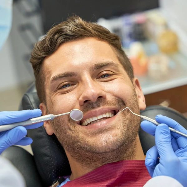 adult man smiling before dental treatment