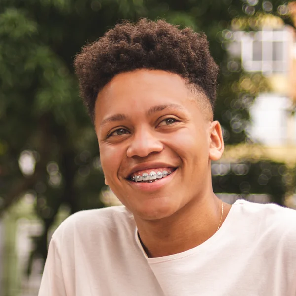 teenager with metal braces smiling