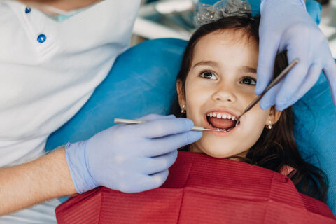 A girl getting het dental checkup