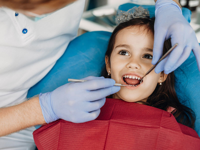 A girl getting het dental checkup